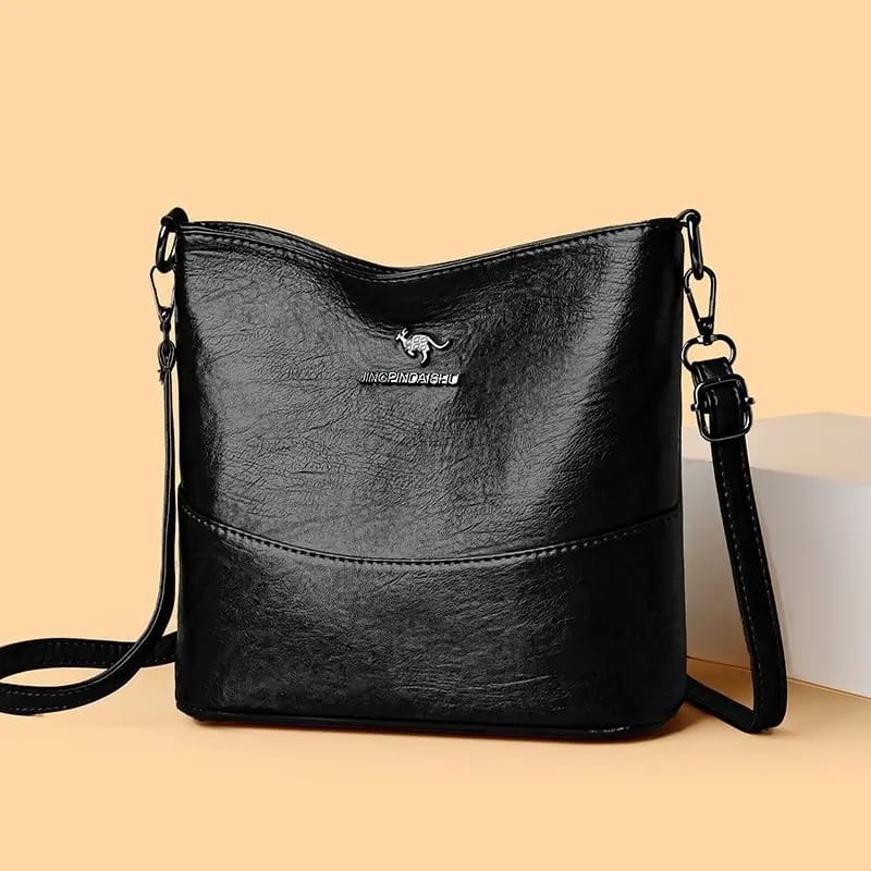 The Jingpindaishe Women's Vintage Style Bucket Crossbody Bag delivers both.