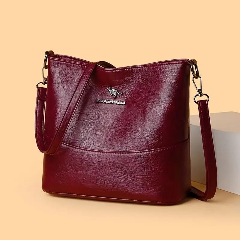 The Jingpindaishe Women's Vintage Style Bucket Crossbody Bag delivers both.